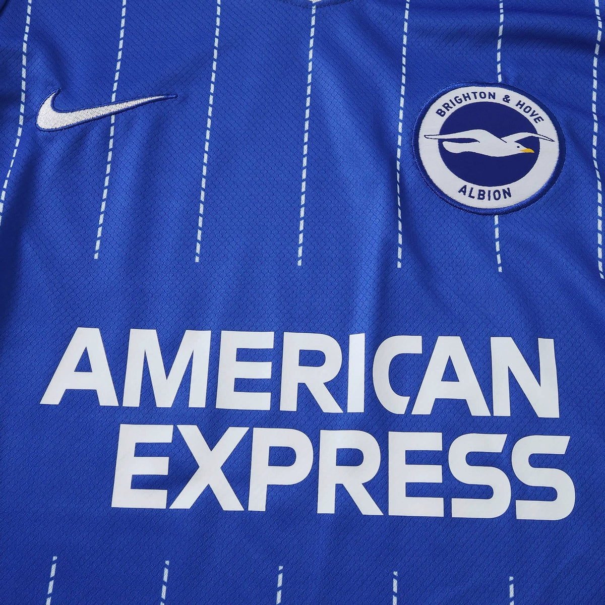 Europe Kits Brighton and Hove Albion home jersey in blue with white pinstripes, Nike logo, and club crest.