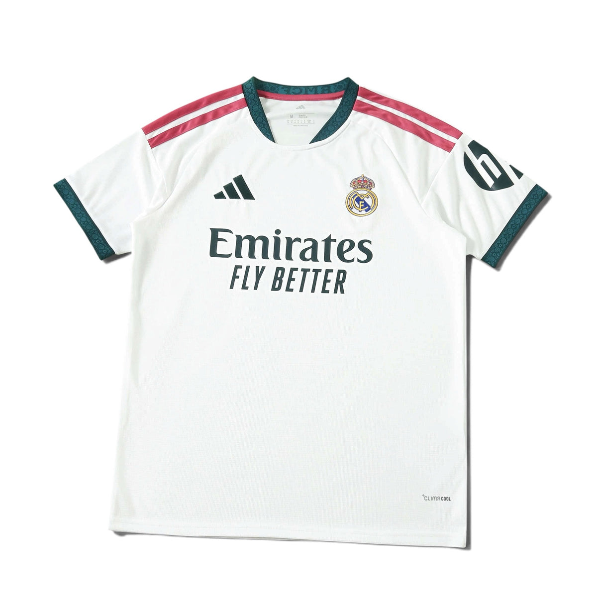 Europe Kits Real Madrid home jersey in white with dark green and pink accents, featuring club crest and sponsor logo.