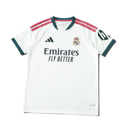 Europe Kits Real Madrid home jersey in white with dark green and pink accents, featuring club crest and sponsor logo.