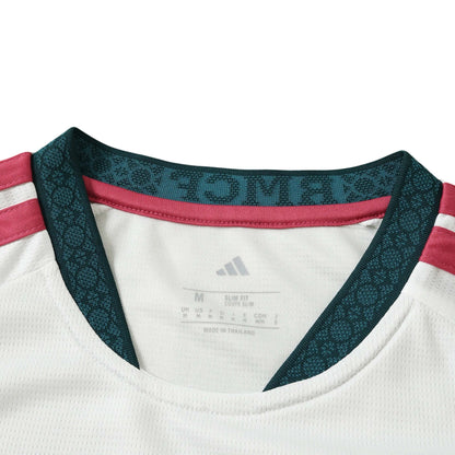 Europe Kits Real Madrid home jersey collar detail with white fabric, dark green trim, and pink accents.